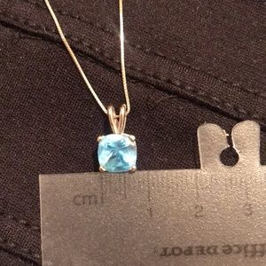 14k solid white gold, blue topaz cushion cut, 7mm.